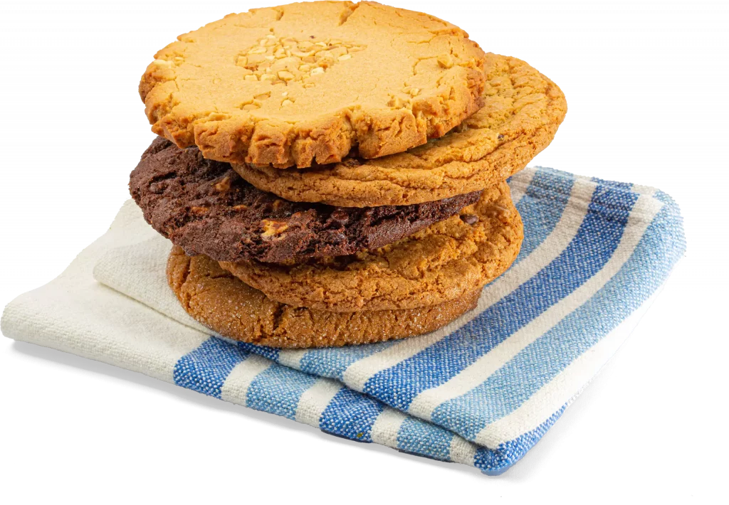 A stack of cookies on a napkin.