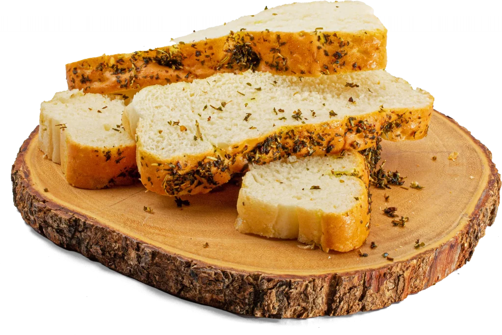 Bread with herbs baked into it on a platter made of raw wood.